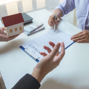 Two people discussing a Contract Review And Drafting